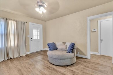 Living area with light hardwood / wood-style floor