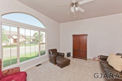 Vaulted ceiling and arched windows.