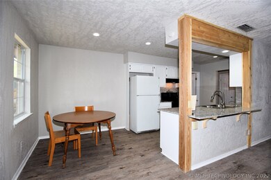 Breakfast nook off kitchen.