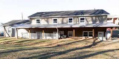 At the back of the house is a large yard and there