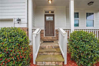 Property entrance with stone siding