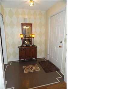Beautiful foyer with handpainted floor!