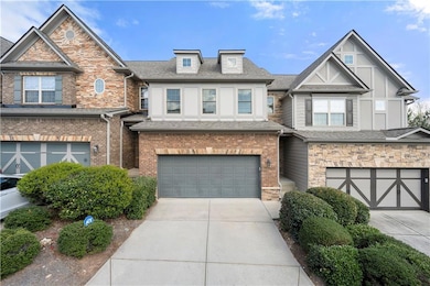 View of front facade featuring an attached garage,