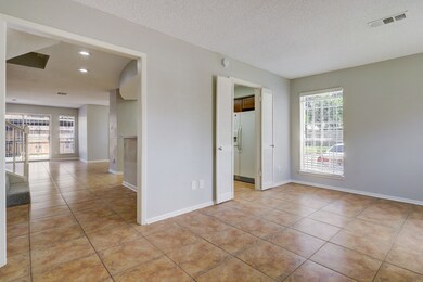 Entry area looks thru entire townhome to family room in rear of home! Note the fresh neutral paint and tile floor thru out!