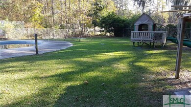 Diving board area & portion of backyard with play 