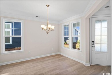 Unfurnished dining area featuring light hardwood /