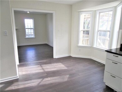 Eat-in Area of the Kitchen offers Bamboo Flooring, Neutral Paint Palette, and a Bay Window that Lets in Lots of Natural Light!