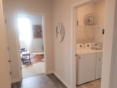 Hallway looking into 4th bedroom / Flex space and laundry.