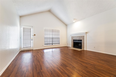 Unfurnished living room with a textured ceiling, d