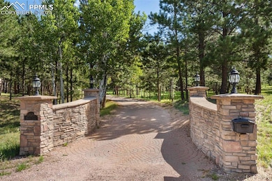 Entrance with tree lined drive