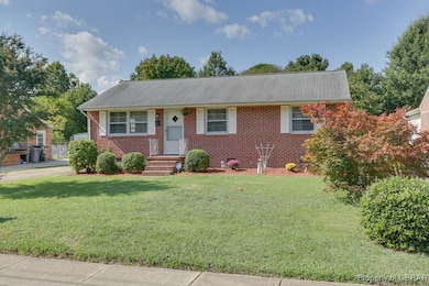 Ranch-style house with a front lawn