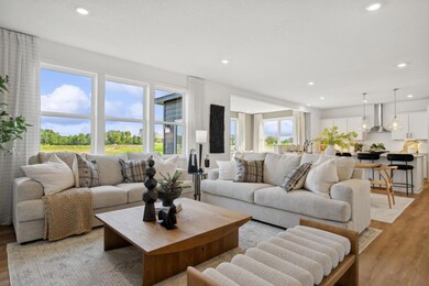 (Photo of a decorated model, actual finishes will vary) The spacious and open-concept main level allows for optimal versatility and comfort.