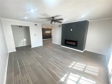 Unfurnished living room with wood finished floors,