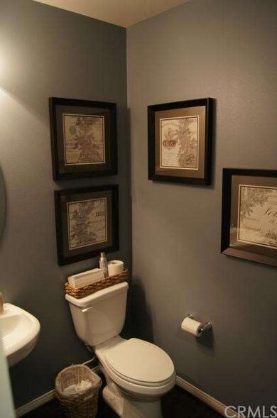 Downstairs powder room. *All photos are from model