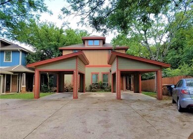 View of front facade with concrete driveway, fenc