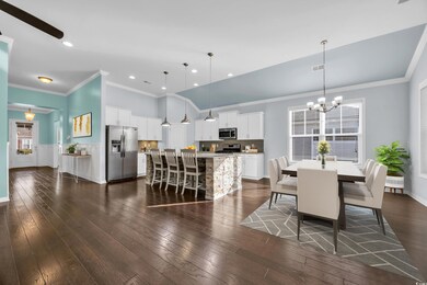 Dining area featuring wainscoting, an inviting cha