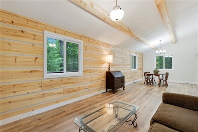 White pine accent walls in living/dining room area.