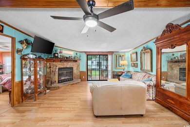 Living room with a textured ceiling, a premium fir