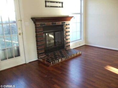 Living Room - The living room has wood flooring an