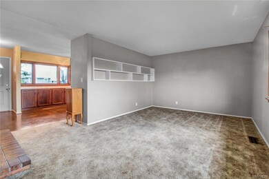 Expanded living space with built-in shelving.