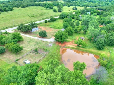 Aerial overview of property's location with rural landscape and a large body of water