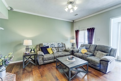 Living area with hardwood / wood-style floors, cei
