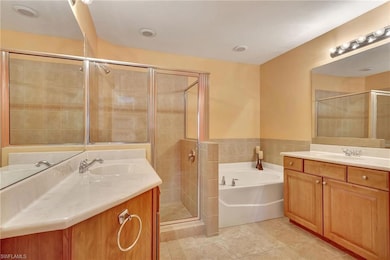 Bathroom with vanity, tile patterned floors, and s