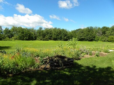 Garden by house looking to back field