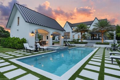 Pool at dusk with a patio area, a pool with connec
