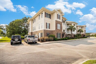 View of property with uncovered parking