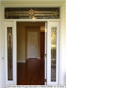 view of beautiful front door with leaded glass ins