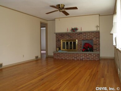 Living Room. Brick Fireplace and Gorgeous Hardwood