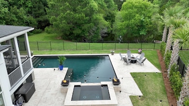 backyard with pond behind the home