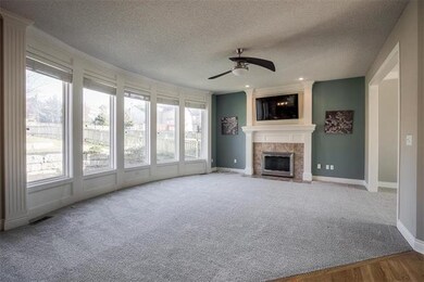 Family Room w/new carpet & paint is open to Kitche