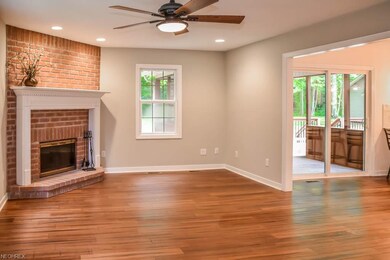 The great room features a beautiful brick fireplac