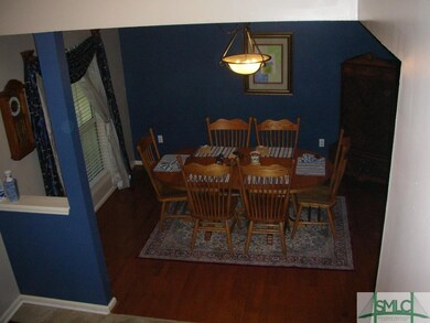 Formal dining room with wood floors is just steps 