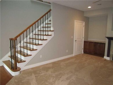 Living Room. Upgraded hardwood stairs and iron rai