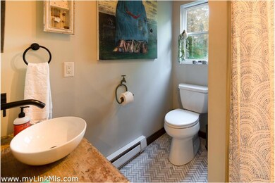 Main Level bath is next to a bedroom