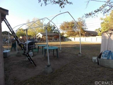 View from right side of house to back yard.