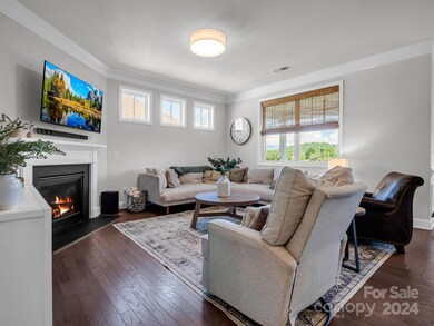 The open floor plan living area provides bright sunlight and gorgeous mountain views.