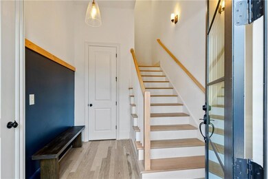 Staircase with wood finished floors