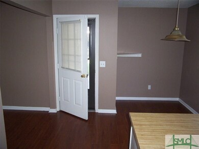 Side Entrance - As I stand in the Kitchen, we view