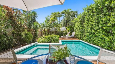 Sunny pool & lush lanscaping