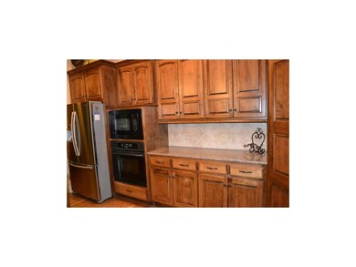 Birch kitchen cabinets, hidden hinges & raised end