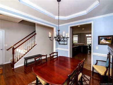 Dining Room with trey ceiling, molding, 2 inch woo