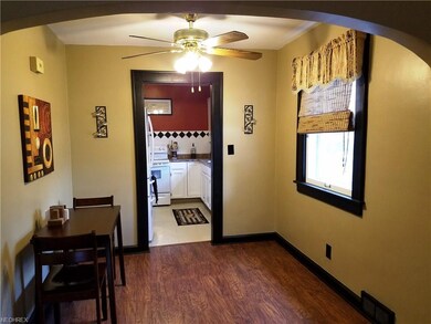 The dining room also has oak floors and is conveni