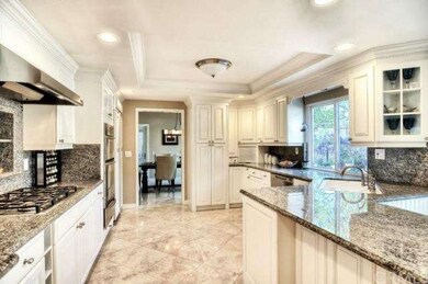 Open kitchen with recessed lighting, custom island