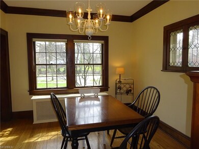 Formal dining room features a beautiful leaded gla