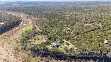 Birds eye view of property with a forest view
