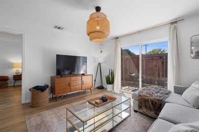 Living area featuring wood finished floors and vi
